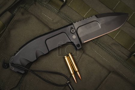 Large folding tactical knife close-up. 