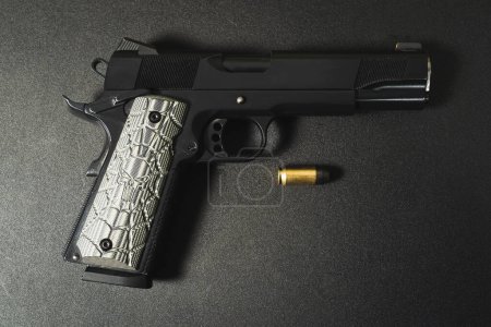 American classic pistol model 1911 for 45 acp caliber. An excellent weapon for self defense. High quality photo