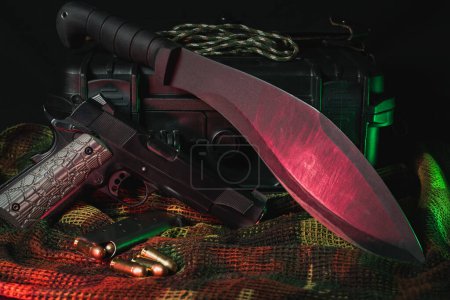 Weapon of the end of the world. Tactical kukri knife and American 45 caliber pistol. 