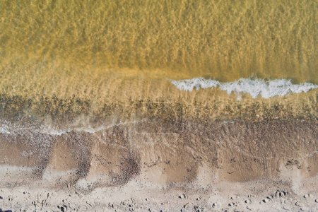 Seashore of the Baltic Sea with clear water, photo from a drone. 