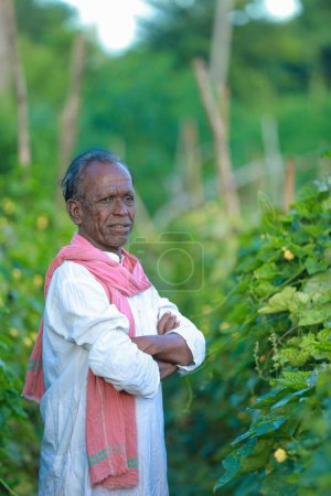 Photo for Indian farming Happy indian farmer standing in farm, sowing Empty Hands - Royalty Free Image