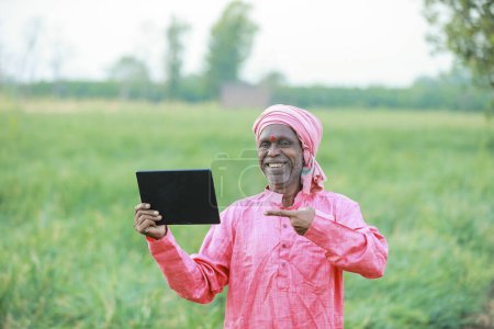 Photo for Indian farmer holding tablet - Royalty Free Image