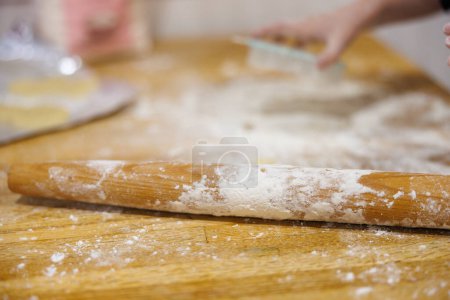 Baking Supplies on Kitchen Table with Flour and Rolling Pin