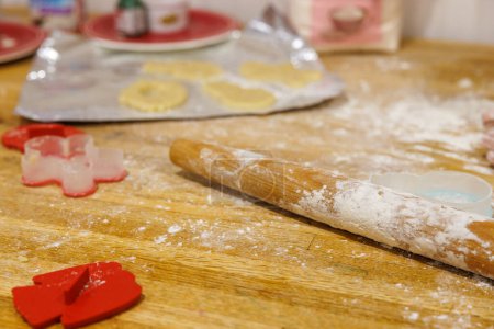 Baking Supplies on Kitchen Table with Flour and Rolling Pin