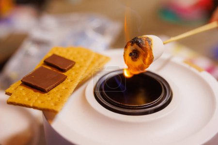 Making S'mores Over a Portable Campfire