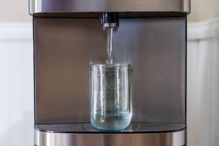 Water Dispenser Filling Glass with Water