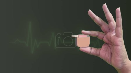Herzschrittmacher in der Hand mit Herzschlagwellen-medizinischem Konzept
