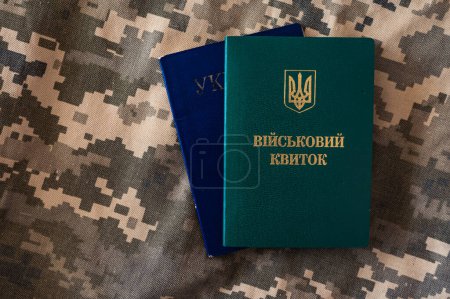 Ukrainian passport and military id identity citizenship doc on pixel camouflage background