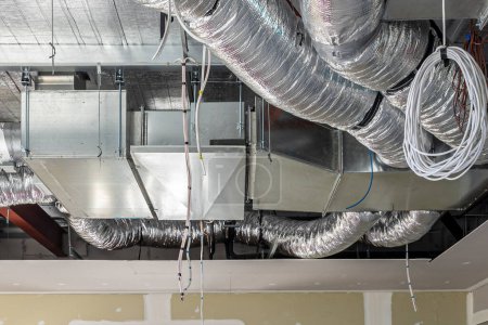 Photo for Air conditioning ducts and electrical wiring construction - Royalty Free Image