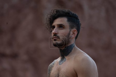 Photo for Tattooed man with piercings shirtless posing - Royalty Free Image
