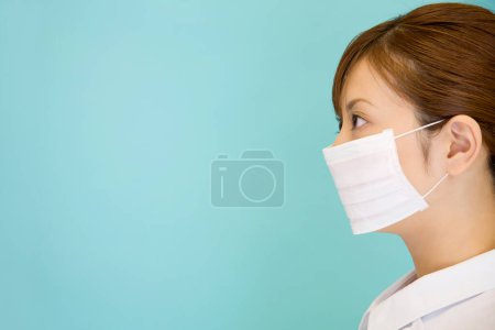 Photo for Doctor wearing face mask with copy space - Royalty Free Image