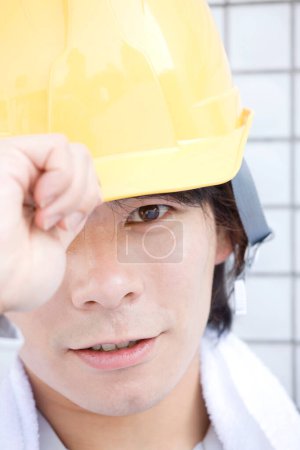 Photo for Asian engineer wearing safety helmet - Royalty Free Image