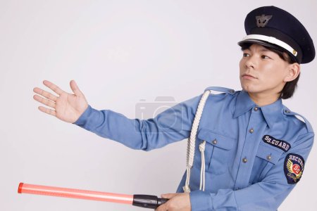 Photo for Studio shot of asian police officer wearing uniform - Royalty Free Image
