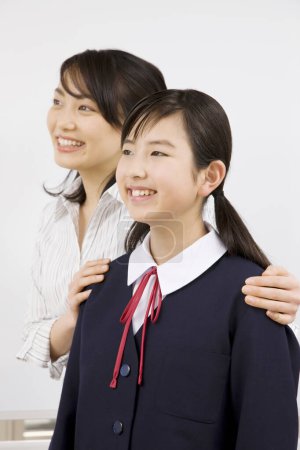 Photo for Asian teacher with student girl - Royalty Free Image