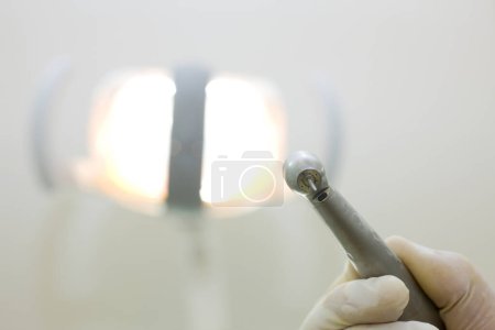 Photo for Dentistry tool, close up view. Dentist holding in hand dental equipment - Royalty Free Image