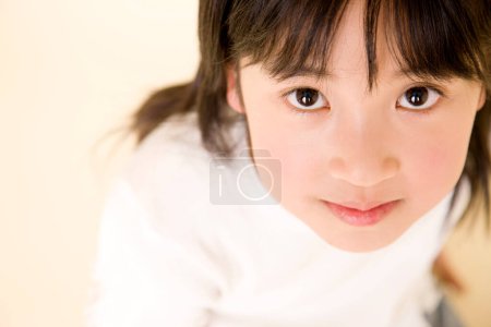 Photo for Little asian girl smiling at camera - Royalty Free Image