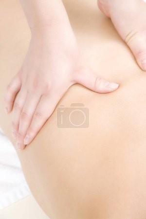 Photo for Young woman receiving massage at spa - Royalty Free Image