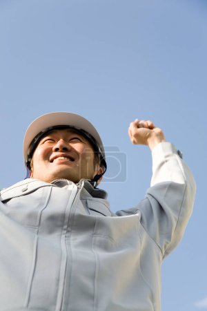 Happy and success Japanese construction worker