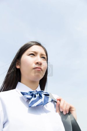 Photo for Asian girl  in school uniform outdoors - Royalty Free Image