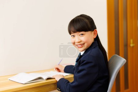 Photo for Close up portrait of asian schoolgirl studying - Royalty Free Image