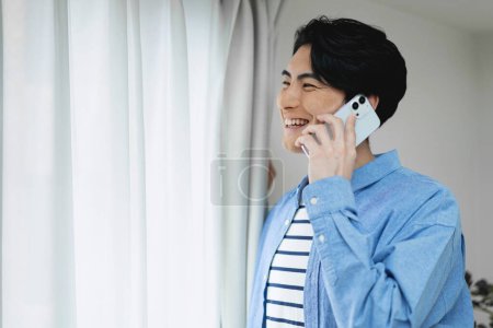 Photo for Young man talking on the cell phone - Royalty Free Image