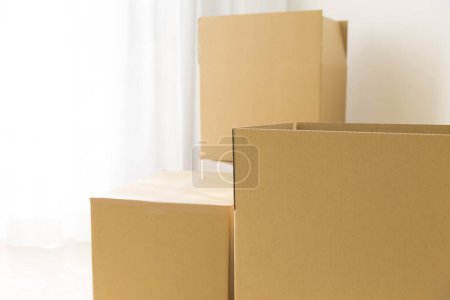 Photo for Cardboard boxes on floor. moving in apartment concept - Royalty Free Image