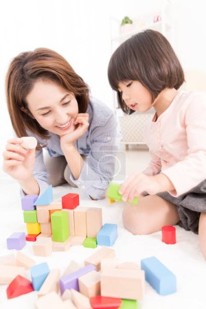 Photo for Asian mother and little daughter playing together - Royalty Free Image