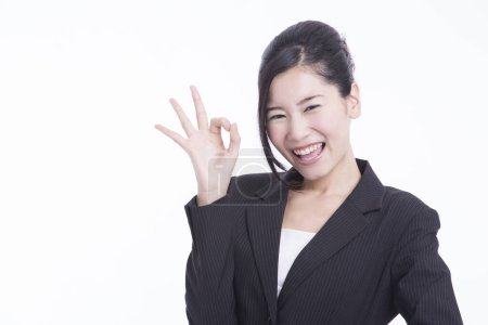 Photo for Young businesswoman showing ok sign isolated - Royalty Free Image