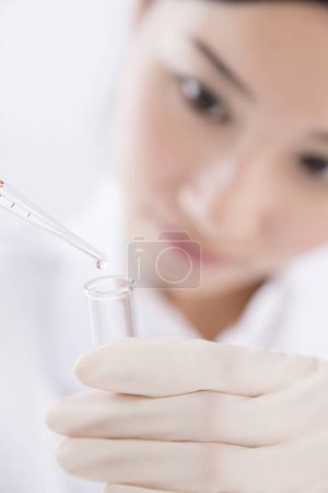 Photo for Female scientist with a pipette , research concept - Royalty Free Image