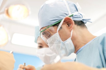 Photo for Close up of Surgeons team working in surgical operating room - Royalty Free Image