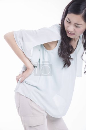 Téléchargez les photos : Vue arrière de la femme souffrant de douleur. - en image libre de droit