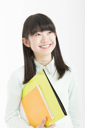 Photo for Portrait of beautiful young Japanese student in school uniform - Royalty Free Image