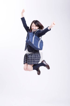 Photo for Young beautiful woman student jumping - Royalty Free Image