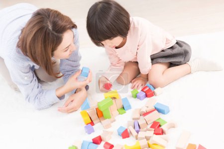 Photo for Asian mother and little daughter playing together - Royalty Free Image