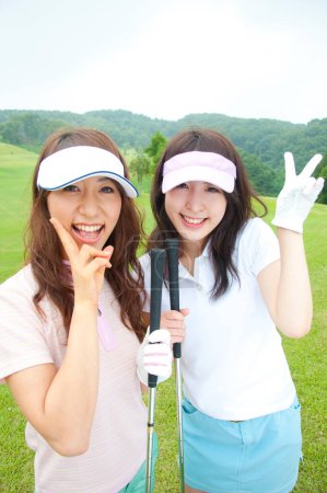 Foto de Primer plano asiático mujeres jugadores de golf - Imagen libre de derechos