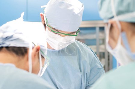 Photo for Close up of Surgeons team working in surgical operating room - Royalty Free Image