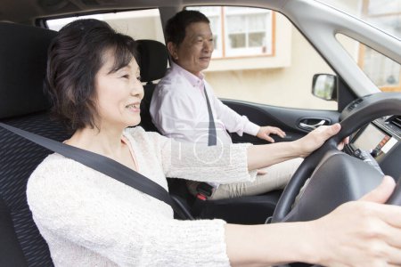 Photo for Asian senior man and woman in car - Royalty Free Image