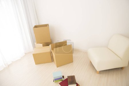 Photo for Cardboard boxes on floor. moving in apartment concept - Royalty Free Image