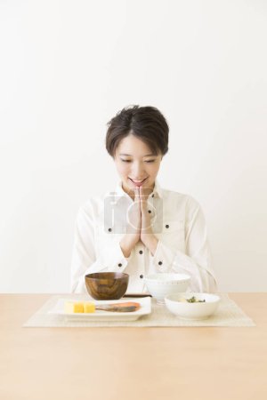 Photo for Beautiful  Japanese woman having a lunch - Royalty Free Image