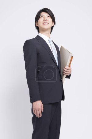 Foto de Asiático joven hombre de negocios con carpetas - Imagen libre de derechos