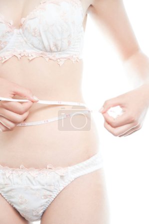Téléchargez les photos : Femme en lingerie blanche taille mesure - en image libre de droit