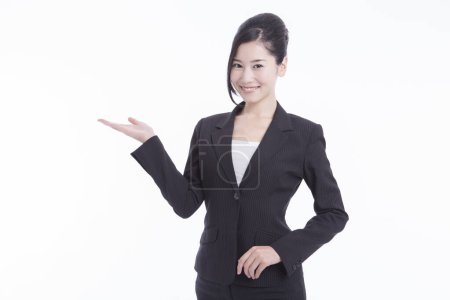 Photo for Young japanese businesswoman in casual suit standing on white studio background - Royalty Free Image