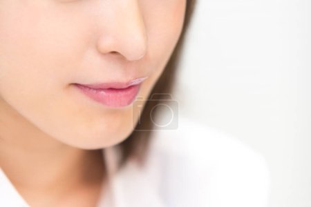 Photo for Closeup portrait of young Japanese woman in white shirt, isolated on white background - Royalty Free Image