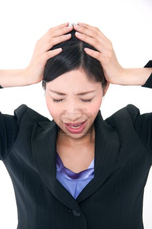 Foto de Mujer de negocios con dolor de cabeza sobre fondo aislado - Imagen libre de derechos