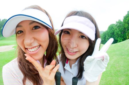 Téléchargez les photos : Gros plan asiatique femmes joueurs de golf - en image libre de droit