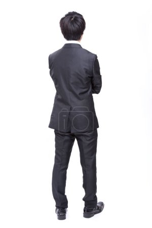 Photo for Back view of businessman standing, studio shot - Royalty Free Image