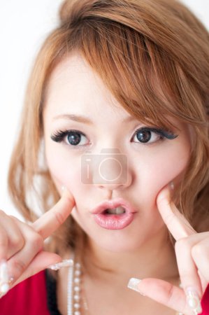 asian japanese woman pointing cheeks 