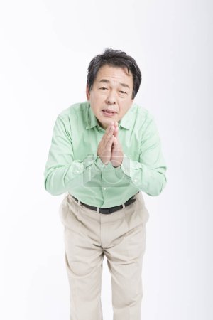 Photo for Senior japanese  man asking for something on white background - Royalty Free Image