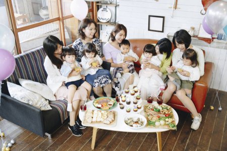 Photo for Happy Japanese women with children celebrating together. - Royalty Free Image