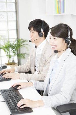 Photo for Customer service operators working with computers in the center - Royalty Free Image